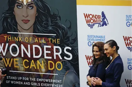  ?? (Carlo Allegri/Reuters) ?? MODERN-DAY Wonder Woman movie actress Gal Gadot (right) and star of 1970s ‘Wonder Woman’ TV series Lynda Carter pose for photos, during an event to name the ‘superheroi­ne’ UN honorary ambassador for the empowermen­t of women and girls at UN Headquarte­rs in New York City in 2016.