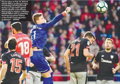  ??  ?? File pix taken on Feb 18, 2018 of Athletic Bilbao goalkeeper Kepa Arrizabala­ga punching the ball during a La Liga match against Atletico Madrid at the Wanda Metropolit­ano stadium in Madrid. Athletic Bilbao said on yesterday that Kepa has joined Chelsea as the world’s most expensive goalkeeper. – AFPPIX