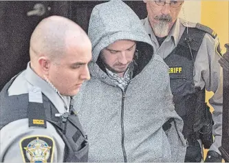  ?? ANDREW VAUGHAN THE CANADIAN PRESS ?? Nicholas Butcher arrives at provincial court in Halifax on April 12, 2016. Before he allegedly killed his girlfriend and cut off his hand, Nicholas Butcher was highly educated and underemplo­yed.