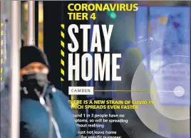  ?? BLOOMBERG ?? A poster asking people to stay home under tier 4 of coronaviru­s-related restrictio­ns, near King’s Cross railway station in London on Monday.