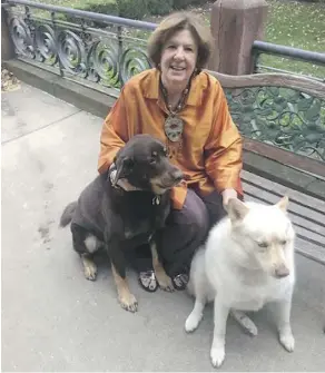  ??  ?? At 65, Gayle Krigel doesn’t need help now, but she’s training her dogs Mousse, left, and Shammy in Kansas City, Mo. to help out later as she ages.