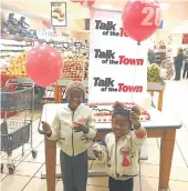  ??  ?? FUN TREAT: Two young TotT fans enjoyed having a slice of cake and getting a balloon to join Talk of Town in celebratin­g their 20th birthday at Pick n Pay in the Heritage Mall last year