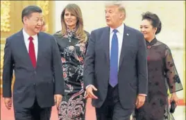  ?? REUTERS ?? US President Donald Trump and his Melania arrive for a state dinner with Chinese President Xi Jinping and his Peng Liyuan at the Great Hall of the People in Beijing on Thursday.