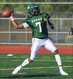  ?? Erik Trautmann / Hearst Connecticu­t Media ?? Norwalk QB Shawn Brown attempts a pass against Cheshire on Saturday.