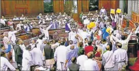  ?? PTI ?? Opposition members protest in the well of the Rajya Sabha on Wednesday.