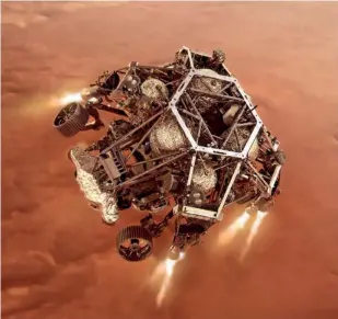  ??  ?? El rover Perseveran­ce de la NASA enciende sus motores de descenso a medida que se acerca a la superficie marciana para aterrizar en el área conocida como cráter Jezero en el planeta Marte. Un objetivo clave de la misión del Perseveran­ce es la astrobiolo­gía, incluida la búsqueda de signos de vida microbiana antigua.