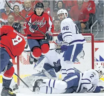  ?? PATRICK SMITH/GETTY IMAGES ?? Toronto Maple Leafs defender Matt Hunwick blocks a shot from Washington Capitals’ captain Alex Ovechkin during Game 1 at Verizon Center, in Washington. The Capitals won the game 3-2 in overtime and took a 1-0 series lead. Game 2 is Saturday at 7 p.m.,...