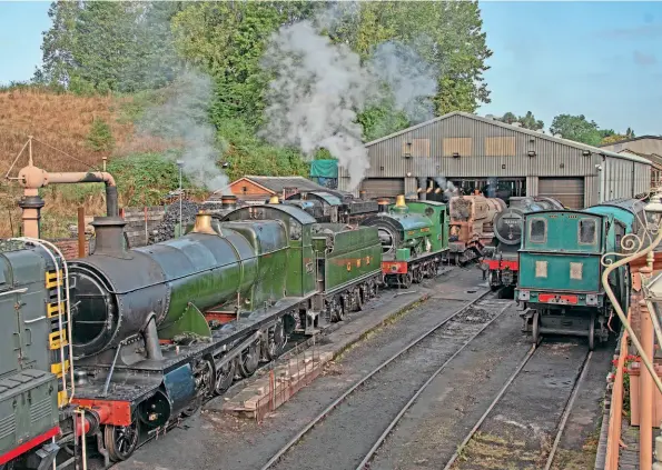  ?? ?? Bridgnorth shed on September 15, the day before the autumn steam gala, with Nos. 2857, 4953, 1501, 813, 4930 (boiler under test), 43106 and Dunrobin in view. The roads are numbered from the right, with Dunrobin on road one; a decision is awaited if this road will be used in future because of the extended wall cladding. No. 43106 is on pit road two; internally this will disappear and be used for work benches and machinery. The small brick building on the left is original; behind the shed is the old goods shed, now the machine shop. The tall building behind is the boiler shop.