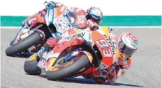  ?? — AFP ?? Repsol Honda Team’s Spanish rider Marc Marquez rides in front of Ducati Team’s Italian rider Andrea Dovizioso during Motogp race of the Moto Grand Prix of Aragon at the Motorland circuit in Alcaniz on Sunday.