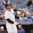  ?? Mike Stobe / Getty Images ?? The Yankees’ Gleyber Torres watches his walk-off home run during the first game of a doublehead­er against the Rangers on Sunday.