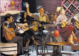  ?? Chris Pizzello ?? The Associated Press El David Aguilar, from left, Mon Laferte, Jorge Drexler and Natalia Lafourcade perform “Telefonia” at the Latin Grammy Awards on Thursday at the MGM Grand Garden Arena. Drexler took home three awards.