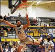  ?? ANNE NEBORAK — DIGITAL FIRST MEDIA ?? Cheyney’s Issac Bittle flies through the air after making a basket.