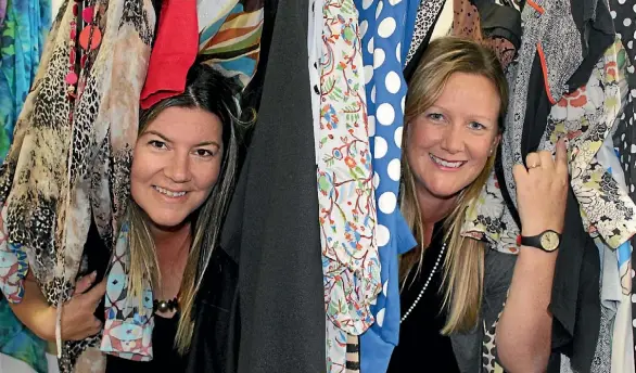  ?? CHRISTINE WALSH ?? Shona Smith and Suzanne Wallworths sort of sorting donated clothing.