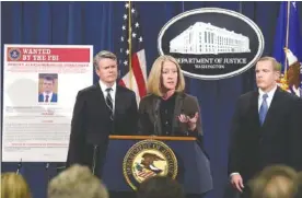  ?? THE ASSOCIATED PRESS ?? Acting Assistant Attorney General Mary McCord, center, accompanie­d by U.S. Attorney for the Northern District Brian Stretch, left, and FBI Executive Director Paul Abbate, speaks during a news conference at the Justice Department in Washington on...