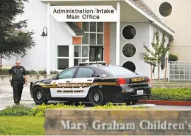  ?? Leah Millis / The Chronicle ?? A San Joaquin County Sheriff ’s deputy returns to his car after responding to a call at the Mary Graham Children’s Shelter in French Camp in April. Hundreds of children in California’s county foster care shelters were arrested and jailed in 2015 and...