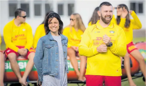  ?? Photo / Michael Craig ?? Maree Mitchell and Bradley Walters, vice president of Surf Life Saving Kariaotahi, who was one of the rescuers in the IRB who saved the trio.