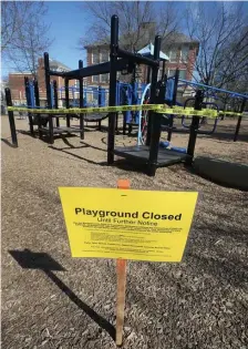  ?? NANCY LANE / BOSTON HERALD ?? NO FUN — UNTIL FURTHER NOTICE: A sign declares the closure of Longwood Playground in Brookline on Monday.