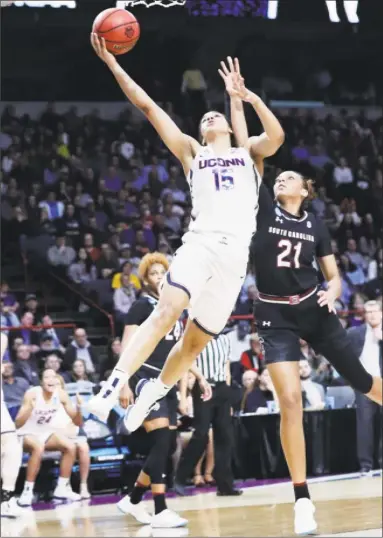  ?? Frank Franklin II / Associated Press ?? UConn’s Gabby Williams drives past South Carolina’s Mikiah Herbert Harrigan during Monday night’s East Regional final in Albany, N.Y.