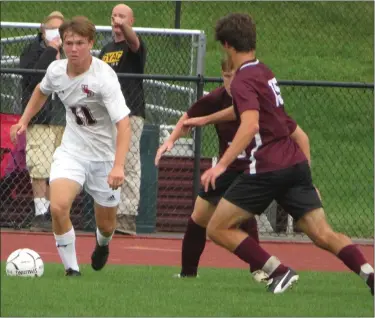  ?? ED MORLOCK/MEDIANEWS GROUP ?? Upper Dublin’s Tommy Clayton (11) looks to make a pass while Abington’s Oscar Hoffman defends on Thursday.