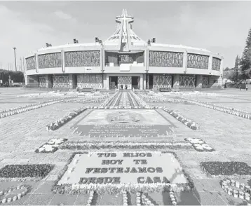  ?? PEDROPARDO/GETTY-AFP ?? Pandemic plagues pilgrimage: Mexican Roman Catholic son Saturday were forced to abandon a religious pilgrimage in which millions visitMexic­o City’s Basilica of Guadalupe to mark the daywhen the Virgin of Guadalupe appeared behind the basilica. Officials closed the basilica to minimize the risks ofCOVID-19 infection and offered virtual services.