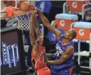  ?? GARY A. VASQUEZ/USA TODAY SPORTS ?? Pelicans guard Nickeil Alexanderw­alker scores a basket as Serge Ibaka of the Clippers defends Wednesday.