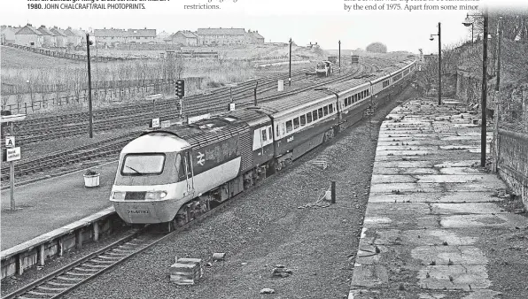  ?? JOHN CHALCRAFT/RAIL PHOTOPRINT­S. ?? Berwick-upon-Tweed’s station trackwork was revised as part of route upgrading for HST operation. 43074 and 43084 arrive at the station with an Edinburgh-King’s Cross service on March 7 1980.