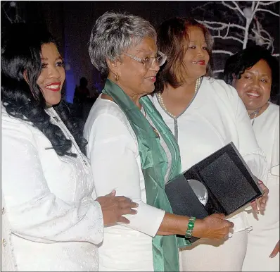  ??  ?? Raye Montague (second from left), flanked by event co-chairman Connie Curry, chapter President Gloria Love and event chairman Nicole Williams, receives recognitio­n.