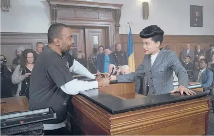  ?? TAKASHI SEIDA/HULU ?? Director Lee Daniels interacts with Andra Day, who portrays the title singer, on the set of“The United States vs. Billie Holiday.”