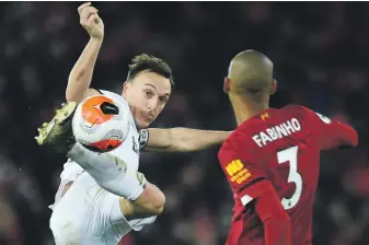  ??  ?? Mark Noble, left, and West Ham gave Liverpool a fright at Anfield on Monday EPA