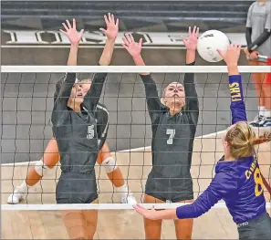  ?? CHRISTIE HEIDELBERG/SPECIAL to The Saline Courier ?? Bauxite juniors Lindsey Cross, 5, and Haley Howard go up for a block in a match earlier this season. The Lady Miners swept three in a row this past week.