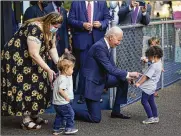  ?? EVAN VUCCI / AP ?? President Joe Biden greets children as he visits the Capitol Child Developmen­t Center, Friday in Hartford, Conn.