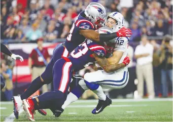  ?? ADAM GLANZMAN/GETTY IMAGES ?? After suffering a handful of injuries while playing for the NFL’s Indianapol­is Colts, quarterbac­k Andrew Luck, right, had enough and announced his retirement before the age of 30.