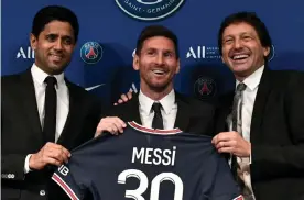  ??  ?? Lionel Messi with PSG’s president, Nasser al-Khelaifi, and sporting director Leonardo (right). Photograph: Stéphane de Sakutin/AFP/Getty Images