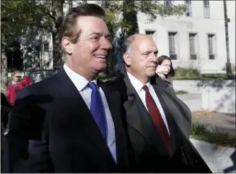  ?? ALEX BRANDON — THE ASSOCIATED PRESS ?? Paul Manafort, left, leaves Federal District Court in Washington, Monday. Manafort, President Donald Trump’s former campaign chairman, and Manafort’s business associate Rick Gates pleaded not guilty to felony charges of conspiracy against the United...