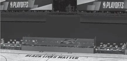  ?? KEVIN C COX/POOL PHOTO VIA USA TODAY SPORTS ?? An empty court and bench is shown with no signage following the scheduled start time Wednesday before Game 5 of the Eastern Conference First Round between the Bucks and the Magic.
