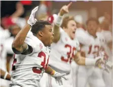  ?? STAFF PHOTO BY C.B. SCHMELTER ?? Alabama running back Damien Harris, shown running onto the field to celebrate Monday night’s 26-23 overtime win against Georgia in the national title game, announced Wednesday he will return for his senior season.