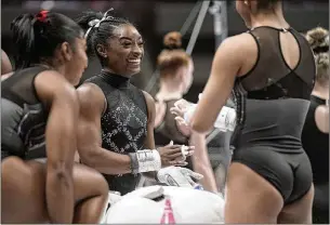  ?? GODOFREDO A. VÁSQUEZ/ASSOCIATED PRESS ?? Asked how she was feeling after the U.S. championsh­ips, Simone Biles (center) said, “Happy that it’s over, happy that I’m back out here competing.”