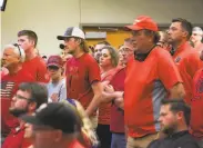  ?? Erin Bormett / Sioux Falls Argus Leader ?? Mask opponents wear red in solidarity during a City Council meeting Sept. 2 in Brookings, S.D.