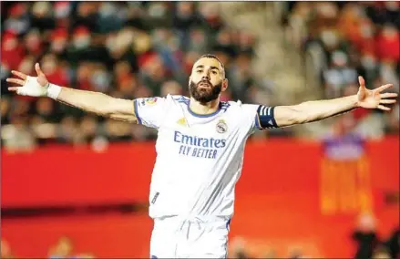  ?? AFP ?? Real Madrid forward Karim Benzema celebrates after scoring his team’s second goal during the Spanish League football match against RCD Mallorca on Monday.