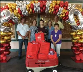  ?? COURTESY PHOTOGRAPH ?? The Lodi Rag Quilters, Ellen Ashbaugh (Founder), Sheryl Carey and Betty Geiszler; Shrine Member, Russelle Smith; Activities Coordinato­r at Shriners Hospital for Children of Northern California, Catherine McDonald and Shriners Volunteer, Bruce Schaffer