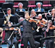  ??  ?? A drowsy intimacy: Joshua Bell, the American soloist, gave a fine performanc­e This concert is available for 30 days on the BBC iplayer. The Proms continue until September 14. Tickets: 020 7070 4441; bbc.co.uk/proms