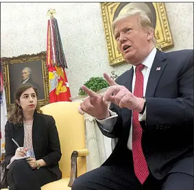  ?? Arkansas Democrat-Gazette/FRANK E. LOCKWOOD ?? President Donald Trump meets Wednesday in the Oval Office with reporters, including Tamar Hallerman (left) of the Atlanta Journal Constituti­on. Among topics he discussed was Arkansas’ U.S. Sen. Tom Cotton, who Trump said he’d been on the phone with just before the press session.