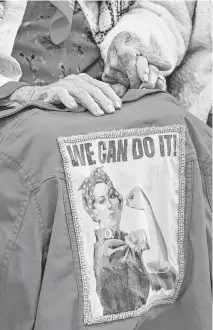  ?? KENNY HOLSTON NYT ?? An image of the iconic Rosie the Riveter poster is seen on a jacket during a Congressio­nal Gold Medal ceremony at the Capitol in Washington on April 10.