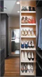  ?? STACY ZARIN GOLDBERG — CASE DESIGN VIA ASSOCIATED PRESS ?? A closet designed by Elena Eskandari, an interior designer specialist at Case Design. A retractabl­e shoe storage area in this closet keeps shoes organized and easily visible for the homeowner.