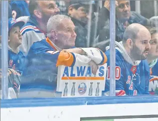  ?? ?? SCORE ONE FOR NEW YORK: Dejected Islanders fans look on in the final minutes of the team’s 4-1 loss to the Rangers at UBS Arena. Kevin Rooney (top) gave the Rangers a 2-0 lead in the second period before he added a second goal in the third period. Robert Sabo (2)