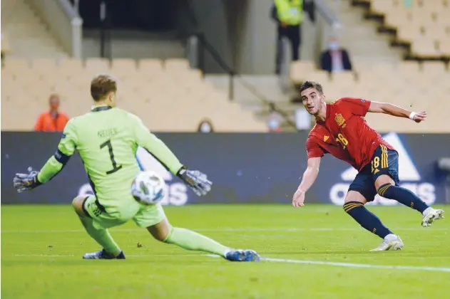  ?? Agence France-presse ?? ↑
Spain’s Ferran Torres (right) scores his third goal against Germany during their Nations League match in Seville on Tuesday.