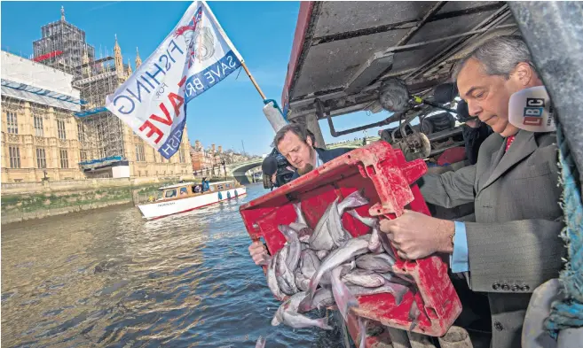  ??  ?? Nigel Farage and Aaron Brown, the spokesman for Fishing For Leave, dump a crate of haddock into the Thames opposite the Houses of Parliament
‘The Tory MPS had no option but to abandon ship – assuming you can abandon a ship you haven’t actually boarded’