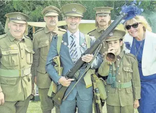  ??  ?? Mayor of Surrey Heath, Cllr Bob Paton, centre, and his wife Carol with 10th Battalion Essex Regiment re-enactors, from left, Tony Weaver, Ian Church, Hugh McCurry and bugler James Church.