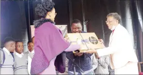  ?? ?? Little Academy Primary School Head teacher Faye Miller receiving the Francophon­ie Award from French Senior Inspector, Annelisa Stoffels after they were crowned the best primary school yesterday.