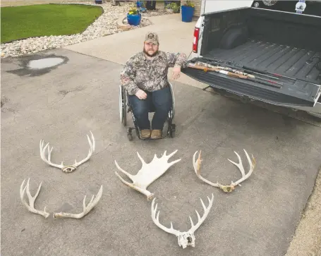  ?? BRANDON HARDER ?? Bobbie Cherepusch­ak, a hunter with disabiliti­es, sits in front of his Lumsden home on June 30. On his truck are a few of his hunting firearms and, in front of him, is an array of antlers he’s collected. The province is now allowing hunters with mobility issues to use specialize­d wheelchair­s.